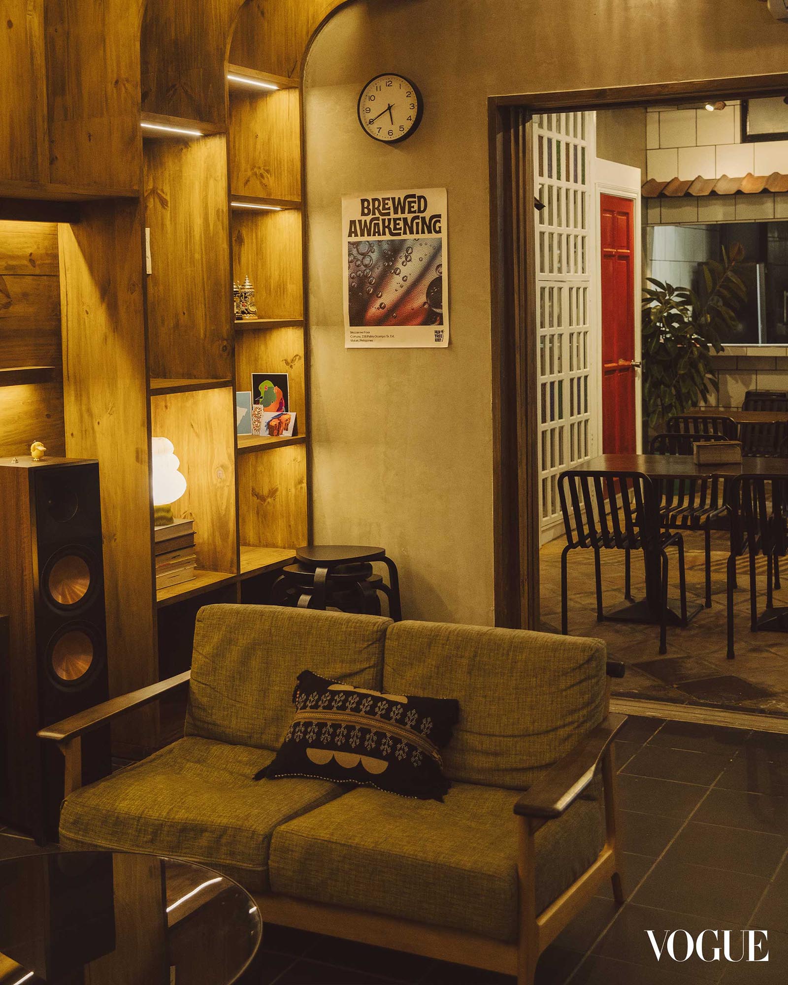 Cozy lounge area inside the Comuna complex with wooden furniture and warm ambient lighting
